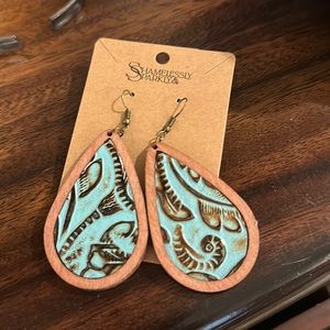 Never worn, brand new with matching wooden bracelet